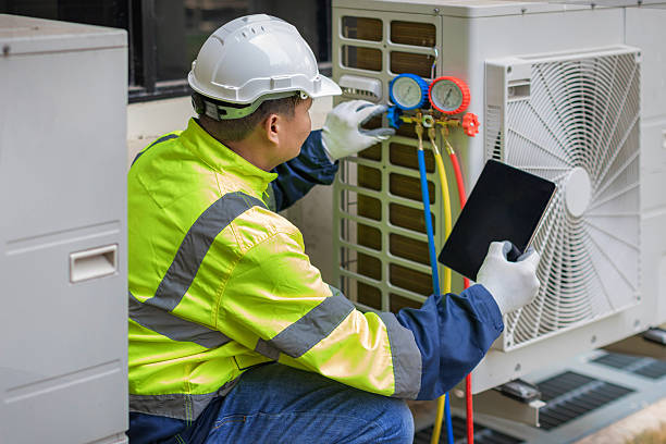 Professional Air Duct Cleaning technician working in East Alton, IL